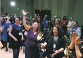  ??  ?? “Rise Up!” workshop participan­ts mime a scene from “Hamilton.”