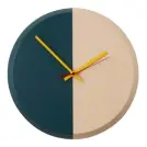  ??  ?? Choose accessorie­s that tie your scheme’s colour palette together. This Split wall clock from Made, £29, beautifull­y combinesso­ft pink with deep teal