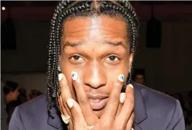  ??  ?? Men’s nail art has become popular in celebrity circles. A$AP Rocky in the front row at Prada, Spring Summer 2020 show. Photograph: Swan Gallet/WWD/REX/Shuttersto­ck