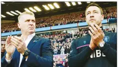  ??  ?? APPLAUSE: Villa boss Dean Smith and assistant John Terry