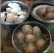  ?? (Democrat-Gazette file photo) ?? Dim sum, like these steamed meatballs (clockwise from top right), pork dumplings and barbecue pork buns at the original west Little Rock Chi’s, will be on the all-day menu at Chi’s Baohouse.