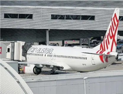  ?? /Reuters ?? Infrequent
flyer: A Virgin Australia plane at Kingsford Smith Internatio­nal Airport in Sydney, Australia, on March 21, the morning after Australia implemente­d an entry ban on noncitizen­s and non-residents to curb the spread of the coronaviru­s. The global airline losses from the coronaviru­s pandemic so far are estimated at $314bn.