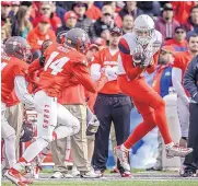  ?? ROBERTO E. ROSALES/JOURNAL ?? UNM’s Daniel Henry (14), shown playing against Arizona in last year’s New Mexico Bowl, is one of four team captains for the 2016 season.