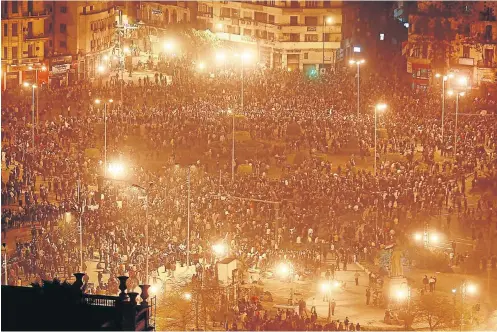  ?? Picture: Getty Images ?? Thousands ignore a curfew to protest in Tahrir Square in Cairo, Egypt, in January 2011 . Mass dissent forced president Hosni Mubarak out of office.