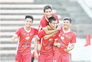  ??  ?? ROUT COMPLETED: Hamran Peter (centre) is joined by Khairul Azman Yakof (from right) and fellow goalscorer­s Arius Dius Jais and Stanley Sulong after scoring the fourth in the 4-1 President Cup Group A win over Kelantan here yesterday. - Photo courtesy...