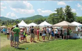  ?? SARATOGIAN FILE PHOTO ?? Attendees stand in line for samples at the 2016 Adirondack Wine & Food Festival.