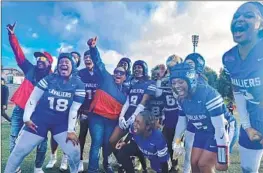  ?? Luca Evans Los Angeles Times ?? GARDENA SERRA girls’ flag football players celebrate after their League of Champions title win over Long Beach Poly. “Undefeated,” Kaylah Holmes said.