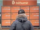  ??  ?? Bitcoin prices track at a virtual currency exchange office Tuesday in Seoul. AHN YOUNG-JOON/AP