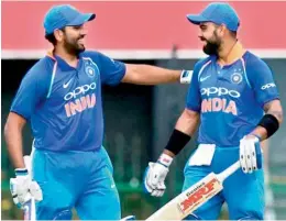  ??  ?? Indian cricket team skipper Virat Kohli (right) shares a light moment with his deputy Rohit Sharma in this file photo.