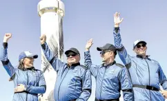  ?? —AFP ?? BEAM US UP Star Trek actor William Shatner (second from left) and flight mates wave after returning from space on Oct. 13 near Van Horn, Texas. Shatner became the oldest person to fly into space on the 10-minute flight.