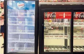  ?? — Bloomberg ?? Running on empty: Refrigerat­ors are left empty in a Walgreens Boots Alliance Inc store in San Juan after Maria hit the island.