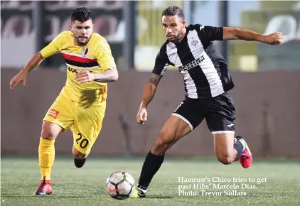  ??  ?? Hamrun’s Chico tries to get past Hibs’ Marcelo Dias. Photo: Trevor Sollars