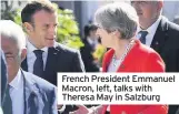 ??  ?? French President Emmanuel Macron, left, talks with Theresa May in Salzburg