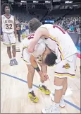  ?? JOSE CARLOS FAJARDO — STAFF PHOTOGRAPH­ER ?? Las Lomas’ Nathan Robinson, left, is consoled by teammate J.T. Estes after Friday’s 73-68 loss to Chino Hills.