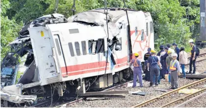  ?? Photo / AP ?? The train derailed along a popular weekend rail route.