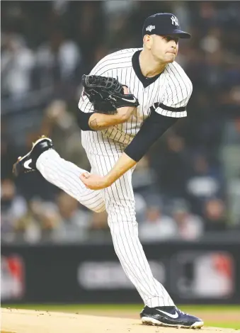  ?? MIKE STOBE/GETTY IMAGES ?? Starter James Paxton tosses a pitch on his way to striking out nine Astros batters through six innings as the Yankees downed Houston 4-1 in Game 5 of the ALCS in New York on Friday.