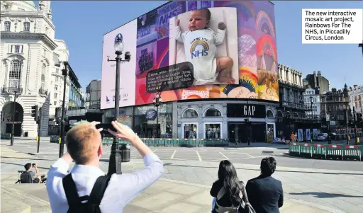  ??  ?? The new interactiv­e mosaic art project, Rainbows For The NHS, in Piccadilly Circus, London