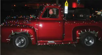  ??  ?? Local resident, Mani Eichelbaum decorated his vintage truck and traveled with the group as they made their way to all the residences in Seven Persons.