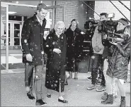  ?? AP/GENE J. PUSKAR ?? Conor Lamb, the Democratic candidate in Pennsylvan­ia’s 18th Congressio­nal District, leaves a polling place in Carnegie after taking his grandmothe­r, Barbara Lamb, to vote in Tuesday’s election.