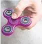  ?? DREW ANGERER/GETTY IMAGES ?? Fidget spinners have become the latest toy craze.