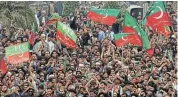  ?? /Reuters ?? Yes he Khan: Supporters of former prime minister Imran Khan’s party, the Pakistan Tehreek-e-Insaf, wave flags in Peshawar, Pakistan. Khan’s party won the most seats in the elections as independen­ts after the party was barred from contesting.