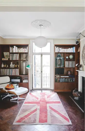  ??  ?? living room
The couple’s collection of curios makes for a fabulous backdrop.
Get the look This is the VW Flag rug by Vivienne Westwood for The Rug Company. The Eames Lounge chair and Ottoman for Vitra are from The Conran Shop.