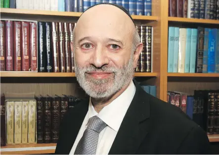  ?? DEAN PILLING ?? Rabbi Yisroel Miller of the House of Jacob Synagogue in southwest Calgary raised his 11 children in the historic neighbourh­ood of Squirrel Hill in Pittsburgh, where 11 Jewish people were murdered by a vile anti-Semite while worshippin­g during Saturday morning prayers.