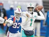  ?? ADRIAN KRAUS/AP ?? Dolphins quarterbac­k Tua Tagovailoa passes in the first half against the Buffalo Bills on Jan. 3 in Orchard Park, N.Y.