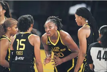  ?? Meg Oliphant Getty Images ?? NNEKA OGWUMIKE (30) was eager to play Arachnneka, a spider-like player who dunks on LeBron James.