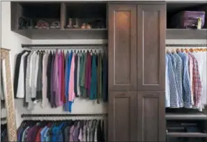  ?? STACY ZARIN GOLDBERG — CASE DESIGN VIA ASSOCIATED PRESS ?? A closet designed by Elena Eskandari, an interior designer specialist at Case Design. As you plan out a walk-in closet, consider the size of the items you’ll be hanging. This closet pictured has two levels of hanging space which offers room for a large...