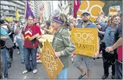  ?? CRAIG RUTTLE — THE ASSOCIATED PRESS FILE ?? Onondaga Nation Faithkeepe­r Oren Lyons, center, actor Mark Ruffalo, far right, and actor Leonardo DiCaprio, center right, join participan­ts during the People’s Climate March in New York.