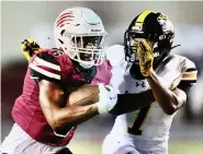  ?? (Photo by JD for the Texarkana Gazette) ?? Liberty-eylau's Greg London runs the ball Friday against Mount Pleasant at Harris Field in Texarkana, Texas. Lightning forced the game to be canceled.