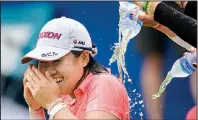  ?? NWA Democrat-Gazette/CHARLIE KAIJO ?? Supporters pour water on Nasa Hataoka after she won the LPGA Northwest Arkansas Championsh­ip on Sunday at the Pinnacle Country Club in Rogers. Hataoka shot an 8-under par 63, finishing with a tournament-best 21-under 192, three better than the mark set last year by So Yeon Ryu.