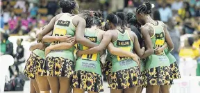  ??  ?? Jamaica’s Sunshine Girls huddle during a match against England in the Sunshine Series earlier this year at the National Indoor Sports Centre.