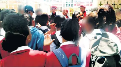  ?? Picture: SIYABONGA SESANT ?? VOWING ACTION: EFF members, from left, Mila Zibi, Thembinkos­i Mfama and Vusumzi Gqalane talk to pupils outside Riebeek College on Tuesday