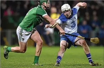  ??  ?? HONOURS EVEN: Waterford’s Shane Bennett (right) and Stephen Walsh of Limerick fight for posession in the Gaelic Grounds