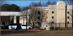  ?? ?? Terror: the Texas shul (left) attacked by Akram, who had watched Ahmed’s videos. Right: armed police outside the synagogue