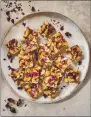  ?? PHOTO BY IAIN BAGWELL ?? Chikki, a sweet brittle made with cashews, rose petals and cardamom, is one of several dessert recipes featured in the new cookbook “Mumbai Modern,” by Amisha Dodhia Gurbani.