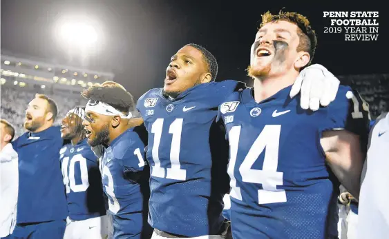  ?? ABBY DREY/CENTRE DAILY TIMES ?? Penn State football players, including linebacker Micah Parsons (11) and quarterbac­k Sean Clifford (14), had plenty to sing about this season.