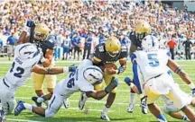  ?? PAULW. GILLESPIE/CAPITAL GAZETTE ?? Navy’s Keenan Reynolds scores against service academy rival Air Force in 2015. Next year’s Navy-Air Force game will be played on the 20th anniversar­y of the 9/11 attacks.