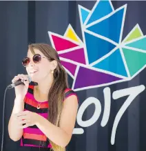  ??  ?? Geneviève RB performs a song onstage at Inspiratio­n Village in the ByWard Market, a venue that will also see live DJs performing on Fridays.