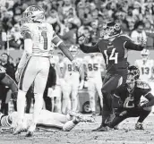  ?? Wade Payne / Associated Press ?? Titans kicker Randy Bullock (14) watches the flight of his go-ahead 44-yard field goal with four seconds left.