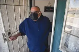  ?? IRFAN KHAN/LOS ANGELES TIMES ?? Luis Parocua, a retired hospital worker who was vaccinated, continues to practice safety measures such as wearing face masks when stepping out of home on Feb. 20 in Monterey Park.