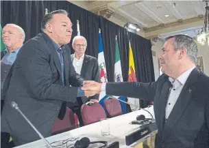  ?? JONATHAN HAYWARD THE CANADIAN PRESS FILE PHOTO ?? Alberta Premier Jason Kenney, right, says Premier François Legault of Quebec misunderst­ands the equalizati­on policy. “If you want to benefit from our oil and gas wealth, stop blocking … pipelines.”