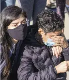  ?? J. SCOTT APPLEWHITE AP ?? Rosio Marin of Washington, left, comforts a close friend who declined to give her name as they mourn the loss of Justice Ruth Bader Ginsburg on Saturday at the Supreme Court building in Washington.