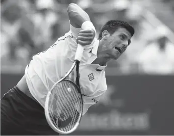  ?? AGENCE FRANCE PRESSE ?? Novak Djokovic of Serbia serves to Sam Querrey of the United States during their men's singles third round match on Day Six of the 2014 US Open at the USTA Billie Jean King National Tennis Center in the Flushing neighborho­od of the Queens borough of...