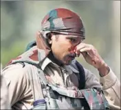  ?? AP & WASEEM ANDRABI/HT ?? A paramilita­ry soldier holds his bleeding nose after being injured during a protest near Panzan, about 35 km south of Srinagar; (right) the funeral procession of Saleem Malik, a civilian, killed on Thursday, proceeds amid protests in Srinagar.