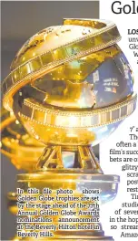  ??  ?? In this file photo shows Golden Globe trophies are set by the stage ahead of the 77th Annual Golden Globe Awards nomination­s announceme­nt at the Beverly Hilton hotel in Beverly Hills.