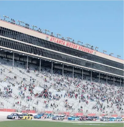  ?? SEAN GARDNER/GETTY ?? Atlanta Motor Speedway, shown during Saturday’s trucks race, will host two Cup events for the first time since 2010.