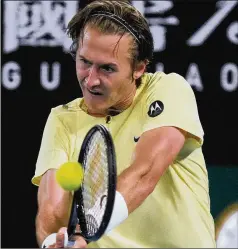  ?? AARON FAVILA/ASSOCIATED PRESS ?? Sebastian Korda of the U.S. plays a backhand return to Daniil Medvedev of Russia during their third-round match at the Australian Open in Melbourne on Friday. Korda won 7-6 (7), 6-3, 7-6 (4).